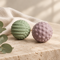 Restyled massage balls in a refined Olive & Ash wellness setting